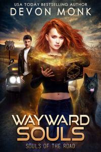 red headed woman holding magic book with stormy sky behind her. Devon Monk Wayward Souls urban fantasy book