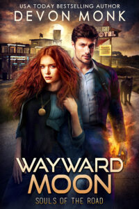 Red haired woman with man behind her, in front of stormy sky and old hotel. Devon Monk urban fantasy book